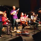 Uke group from Staynor ON! Grandparents on stage with their grandkids and friends!